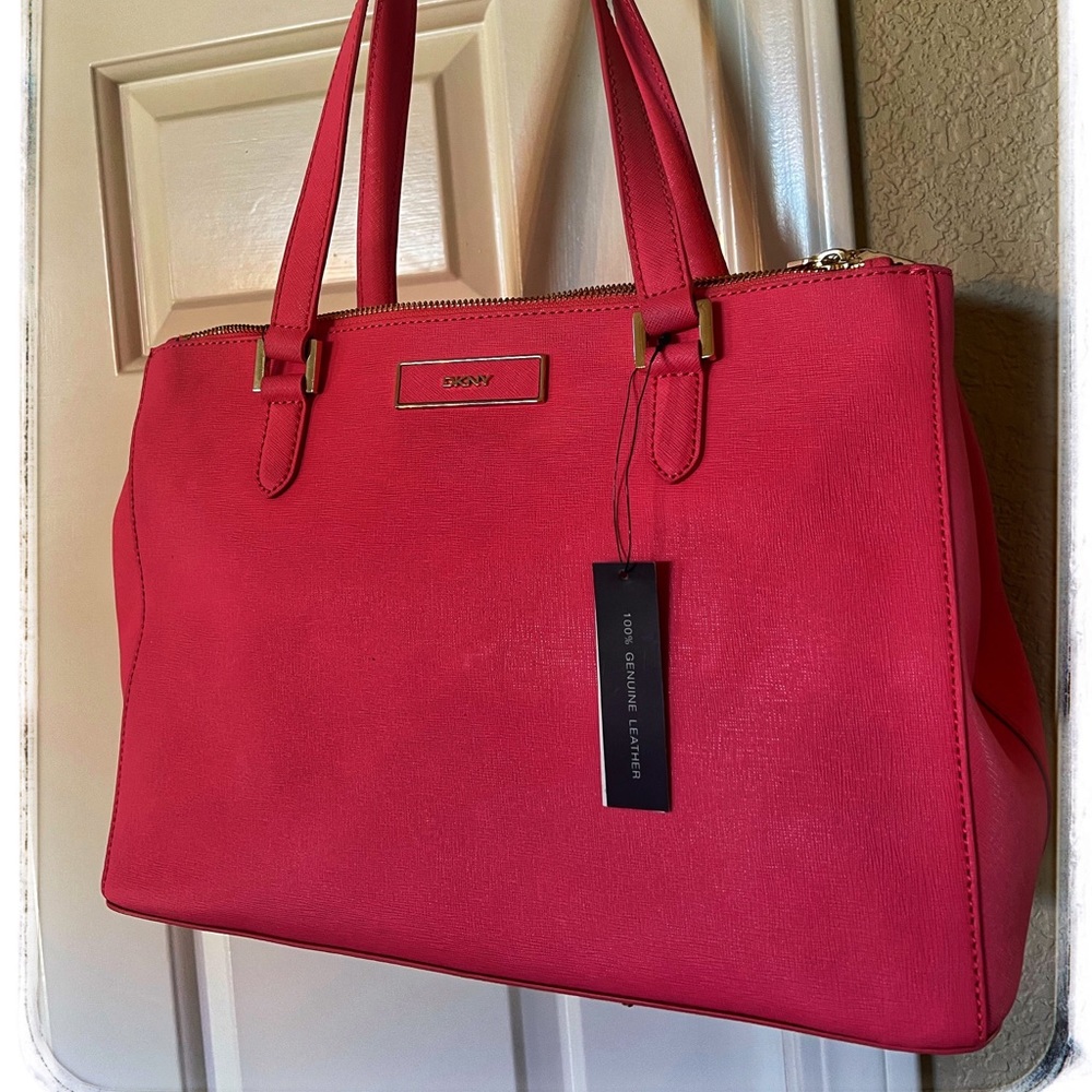 New with Tags DKNY Pink Tote. With white cloth storage bag.